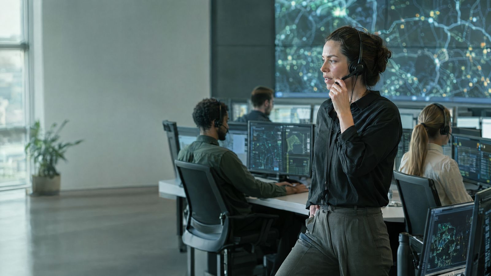 Service operations center with a wall map and coordinators at work